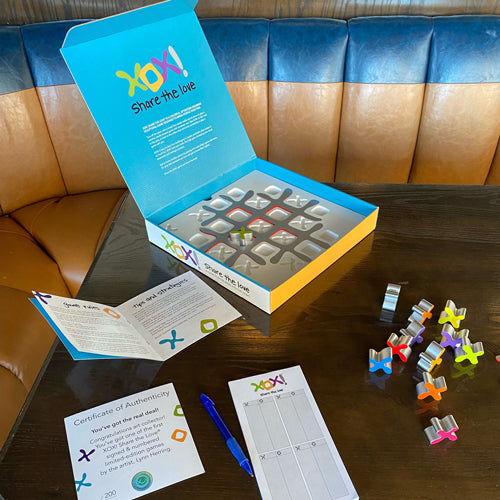 XOX! Share the Love. The fun, artist-signed, special edition board game that doubles as art.